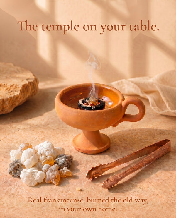 The First Flame ritual kit — resin, burner, tongs and coal laid out on stone